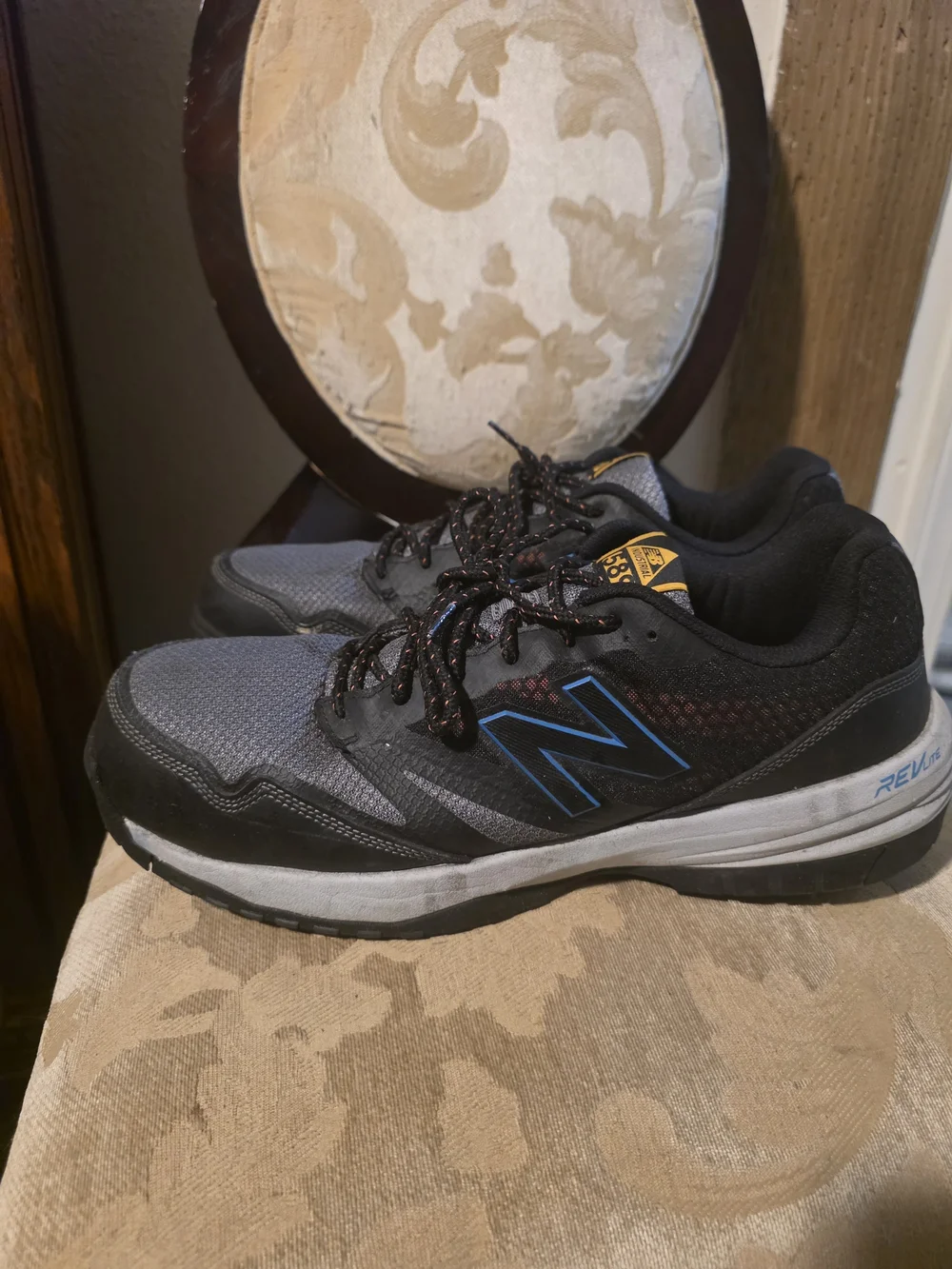 New Balance Gray and Black Men's Athletic Sneakers with Blue Accents